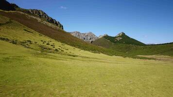 A beautiful landscape with mountains and green fields video