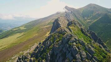 An aerial view of a mountain range with green vegetation video