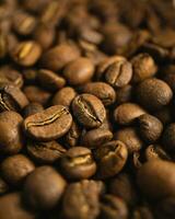 Macro close up photo of roasted coffee beans with shallow depth of field and blurry bokeh background