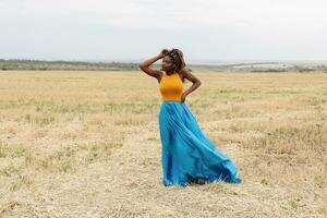 african american young woman having fun outdoors at sunset. photo