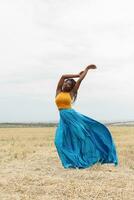 african american young woman having fun outdoors at sunset. photo