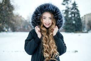 Young woman winter portrait. Shallow dof. photo