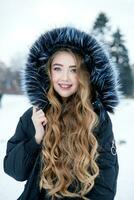 Young woman winter portrait. Shallow dof. photo