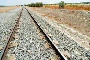 Train tracks on gravel photo