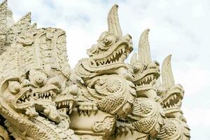 Ornate Naga statues photo