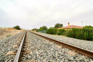 Train tracks on gravel photo