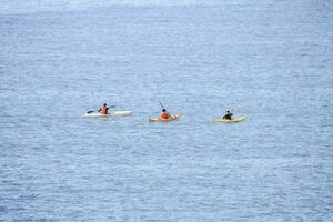 Kayak boats in the ocean photo