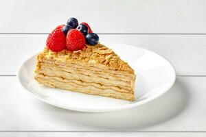 Mille feuille cake with butter pastry cream and fresh berries photo