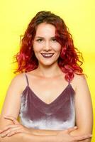 Indoor portrait of excited curly woman with trendy makeup. photo