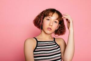 Image of young happy beautiful woman posing isolated over pink photo