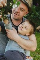 Father and toddler son enjoyng spring nature. Togetherness concept. photo