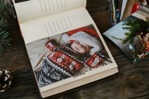 Christmas printed photos in photo album.