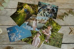 Printed photos on wooden board. Photo printing service concept.