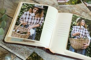 Picture album with printed photos on table. Print store concept.