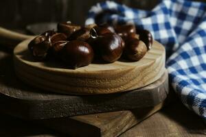 Chestnut on wooden Table Background photo