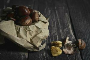 Chestnut on wooden Table Background photo