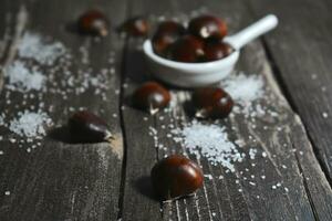 Chestnut on wooden Table Background photo