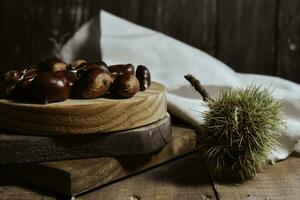 Chestnut on wooden Table Background photo