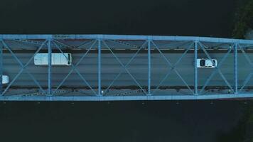Flying over bridge with cars. Aerial top vertical view. video