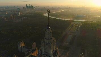 Flying over moscow state university and moscow river in the sunny morning. City in sunrise fog. Aerial view. video