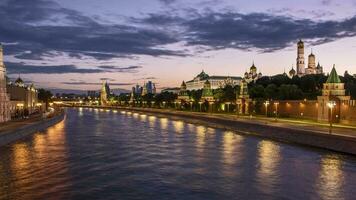 Time lapse of illuminated Moscow Kremlin and Moscow River with ships. Cars traffic on embankment. Russia. video