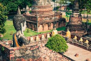 Ancient Buddha statue at Wat Yai Chaimongkol in the historical city, Ayutthaya, Thailand photo
