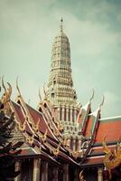 view of the Buddhist Temple Wat Phra Kaew, one of the main landmarks of Bangkok, Thailand photo