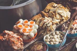 Thai food. Spicy food at Damnoen Saduak Floating Market near Bangkok, Thailand photo