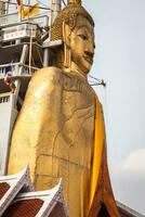 The standing Buddha of Wat Intharawihan in Bangkok, Thailand. photo