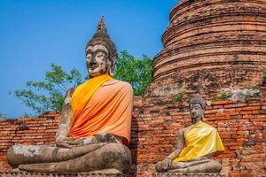 Buddhas at the temple of Wat Yai Chai Mongkol in Ayutthaya,Thailand photo