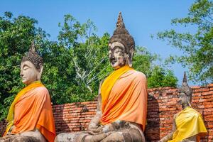 Buddhas at the temple of Wat Yai Chai Mongkol in Ayutthaya,Thailand photo