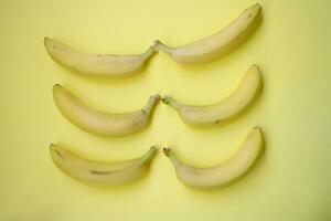 Fresh Banana on yellow background photo