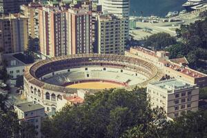 View of Malaga with bullring and harbor. Spain photo