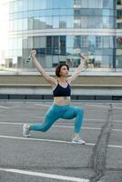 Strong young woman stretching with skipping. photo