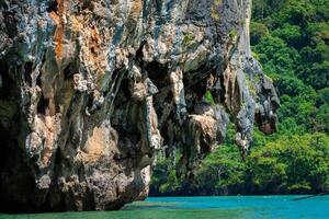 Huge limestone cliff in the Phang Nga bay, Thailand photo