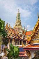 view of the Buddhist Temple Wat Phra Kaew, one of the main landmarks of Bangkok, Thailand photo