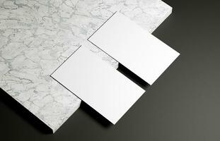 Business card on marble and black background photo