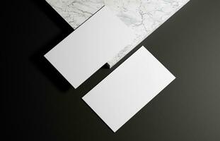 Business card on marble and black background photo