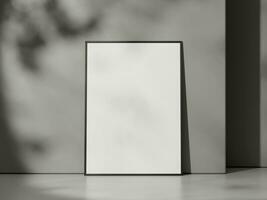 Blank poster with frame mockup on grey wall with shadow photo