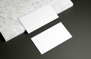 Business card on marble and black background photo
