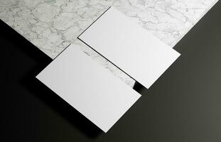 Business card on marble and black background photo