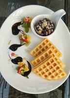triangular waffle with chocolate ice cream photo