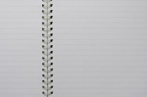 Wirebound Notebook Open with Blank Paper Page for Copy Space Background photo