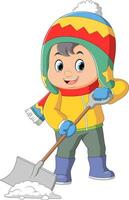 Cartoon little boy in winter clothes shoveling snow vector