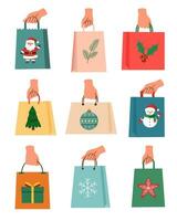 Shopping bags Christmas in the hands vector