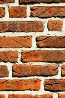 a close up of a brick wall with a few different colors photo