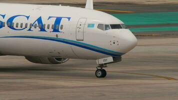 PHUKET, THAILAND FEBRUARY 25, 2023 Passenger plane Boeing 737 MAX of SCAT Airlines taxiing at Phuket airport, middle shot video