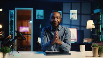 African american content creator filming technology review of newly released laptop, unboxing it and presenting specs to audience. Influencer showing ultra slim notebook to viewers video