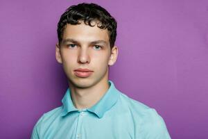 Indoor shot of handsome muscular guy with positive expression photo