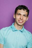 Indoor shot of handsome muscular guy with positive expression photo